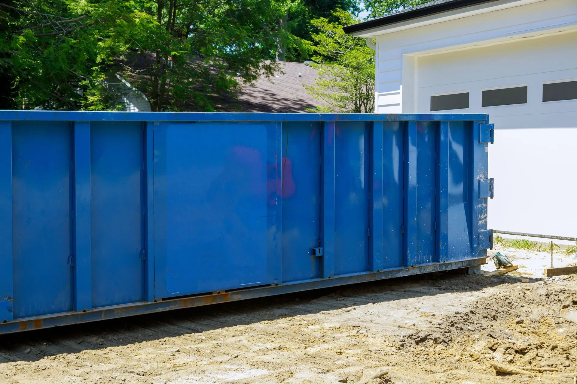 Waste Falcon Residential dumpster rental outside a home